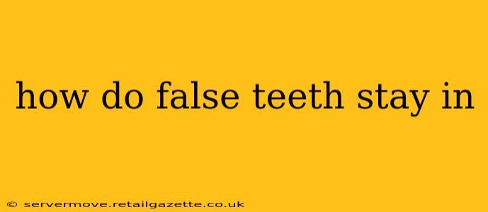 how do false teeth stay in